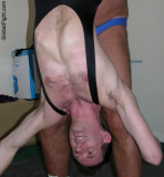 wrestler man held upside down.jpeg