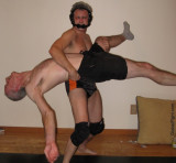 collegiate wrestling dude beating up older man.jpg