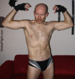 slender balding goatee daddy bear wrestler man flexing.jpg