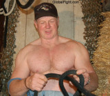 navy rodeo man tieing rope tiedup barn working hard.jpg