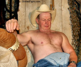 sleepy cowboy sleeping in barn hay bales.jpeg