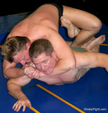 hunky middle aged men wrestling chokeholds.jpg