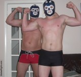 young tagteam pro wrestlers flexing biceps.jpg