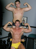 wrestling musclemen pro wrestlers flexing muscles.jpg