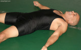 hairy black man jock resting wrestling mats.jpg
