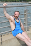 hairybear wrestler man sitting boardwalk ocean pier.jpg