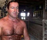 daddy working shirtless barn throwing hay bales.jpg