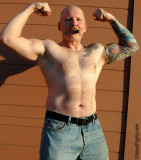 cigar pig leather daddy flexing double biceps big arms.jpg