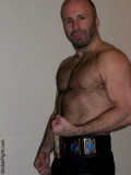 cock wrestler posing wrestling belt flexing hairy arms.jpg