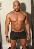 big hunky gay bodybuilder huge thick biceps muscles.jpg