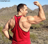 muscleman muscular jock flexing tanktop desert hiking gay dude.jpg