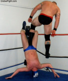 wrestler ball stomping mans face hitting kicking stepping on guy.jpg