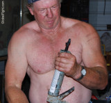 big macho man mechanic garage jerking jacking lube gun.jpg