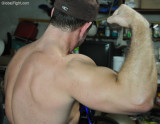 studly muscleman gym rat flexing back muscles.jpg