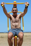 hairy daddy beach workout weight lifting older men.jpg