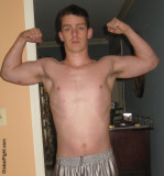 young cocky stud buck flexing muscular arms.jpg