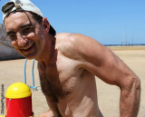 hairy daddy romping on beach sandy shores.jpg