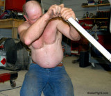 man working hot garage sweaty shirtless.jpg