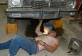 muscledad working on car changing oil.jpg