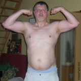 heavyset gay man flexing arms goatee pics.jpg