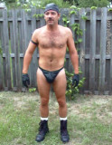 very country leatherman posing backyard dad.jpg