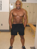 black muscledude lockerroom posing.jpg
