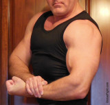 brother flexing tanktop big muscles.jpg