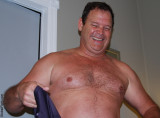 big furry chest man removing shirt.jpg