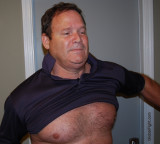 man pulling off shirt removing clothes.jpg