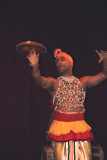 In the next dance, the dancers spun saucers simultaneously on their nose and hands.