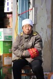 The woman wore an armband with Chinese writing.