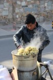 Vendor steaming ears of corn in Beijing.