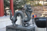 Bronze dragon sculpture in front of the Hall of Benevolence and Longevity.
