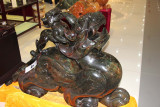 A jade dragon with a baby on her back.