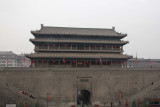 The wall has a moat and a circular park.  It surrounds the inner city of Xian.