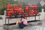 Thats my tour guide, Jenna, making an offering with candles outside of the pagoda.