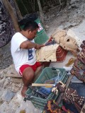 Man carving a Maya mask.