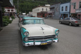 The turquoise and white car was beautifully restored.