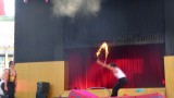 The man holding the hoop did the jumping.