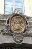 Close-up of coat of arms over the doorway.