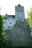Frontal southern view of Bran Castle which is on the top of a rock.