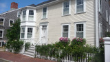 A Nantucket house with roses and window boxes.
