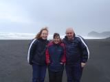 Leonie, me and Uncle Paul getting sand blasted at Piha.JPG