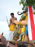 A young priest, representing Lord Subramanyam (Murugan), beheads the demon Gajamukha. Skanda Sashti at Tiruchendur.