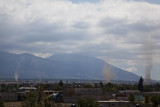 Dust devils over Tlachichuca as Orizaba and Sierra Negra are in the clouds.