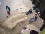 Sandy sofa sitting on the south side shore