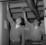 Two sailors painting aboard the USS Hugh Purvis DD 709