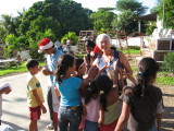Renda passing out gifts to the kids