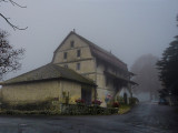 The old lonely farmhouse in the fog