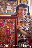 Rosy holding Huichol Yarn Painting